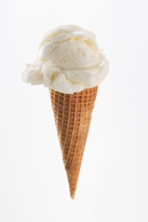 Close up of vanilla ice cream cone.