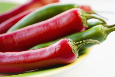 Studio shot of red and green Chili Peppers.