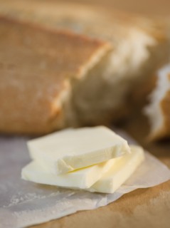 Slices of butter and fresh breadClose-up. Photo : Jamie Grill Photography