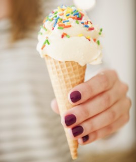 , female hand holding ice cream. Photo : Jamie Grill Photography