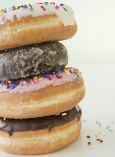 Stack of donuts, close-up. Photo : Jamie Grill Photography