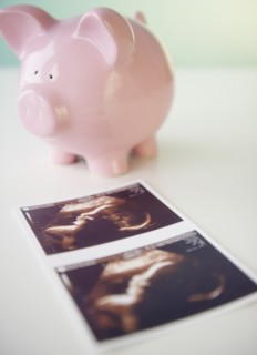 Sonogram picture and piggy bank. Photo : Jamie Grill Photography