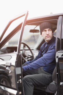Man in workout wear getting out of truck. Photo : Take A Pix Media