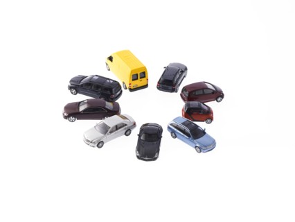 Circle of different cars on white background. Photo : David Arky