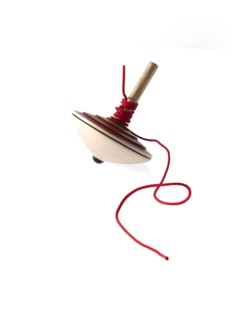 Spinning top on white background. Photo : David Arky