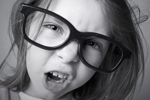 Close-up of girl (6-7) shouting. Photo : Justin Paget