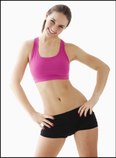 Studio portrait of young woman exercising. Photo : Mike Kemp