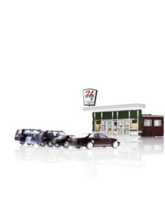 Toy cars in front of toy gas station. Photo: David Arky