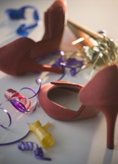 Red high heels and streamers. Photo : Jamie Grill Photography