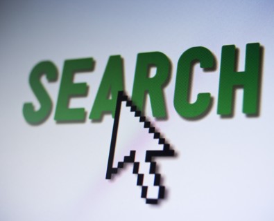 Studio shot of arrow cursor on search button. Photo : Jamie Grill Photography