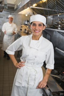 Chef and cook in commercial kitchen.