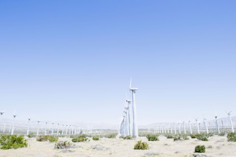 USA, California, Palm Springs, Coachella Valley, San Gorgonio Pass, Wind turbines against blue sky.