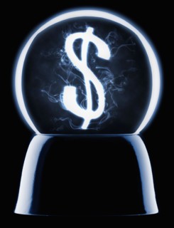 Studio shot of crystal ball showing dollar symbol. Photo : Mike Kemp