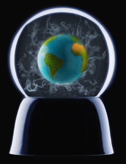 Studio shot of crystal ball showing globe inside. Photo : Mike Kemp