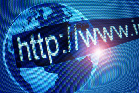 Computer generated picture of globe and web address on foreground.