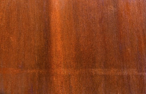 Close-up of brown wooden surface.