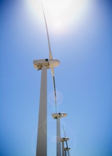 USA, California, Palm Springs, Coachella Valley, San Gorgonio Pass, Wind turbines against blue sky.