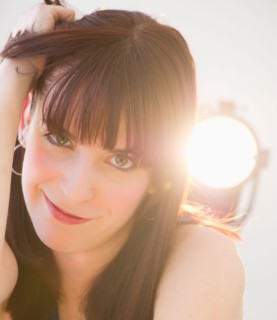 Portrait of cheerful young woman. Photo : Daniel Grill