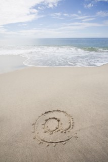 USA, Massachusetts, At sign drawn on sandy beach. Photo : Chris Hackett