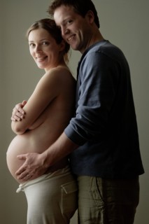 Studio portrait of expectant couple. Photo : Rob Lewine