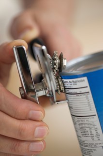 Man opening can.