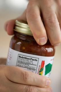 Man opening jar.