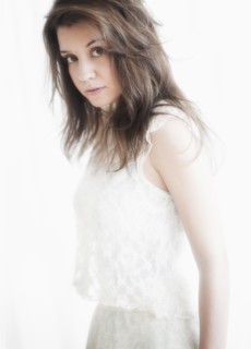 Studio portrait of young woman.