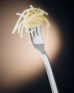 Close up of fork with spaghetti on black background. Photo : Jamie Grill Photography