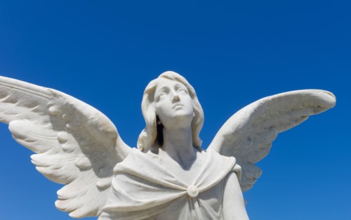 Puerto Rico, Old San Juan, Santa Maria Magdalena Cemetery, Close-up view of praying angel statue.