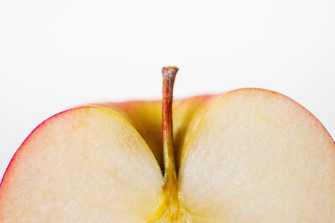 Close up of half of apple, studio shot.