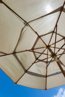 Sunshade against blue sky.