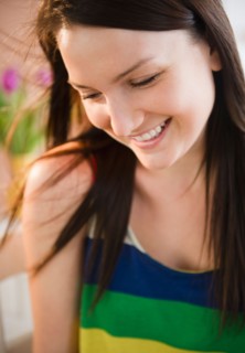 Portrait of smiling young woman. Photo : Jamie Grill Photography
