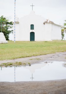 Brazil, Bahia, Trancoso, Church reflecting in puddle. Photo : Jamie Grill Photography