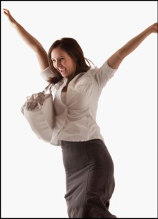 Studio shot of cheering woman. Photo : Mike Kemp