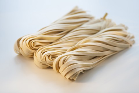 Studio shot of fresh linguini pasta.