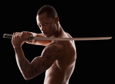 Studio shot of martial arts practitioner with Katana sword. Photo : Mike Kemp