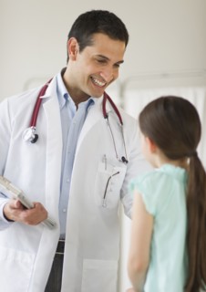 Doctor talking to girl (8-9).