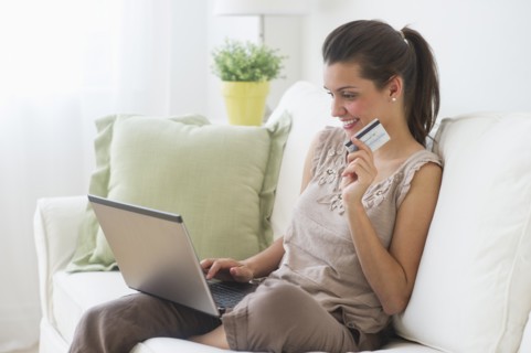 Young woman online shopping .