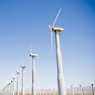 USA, California, Palm Springs, Coachella Valley, San Gorgonio Pass, Wind turbines against blue sky.