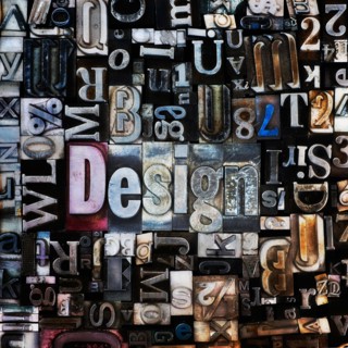 Assortment of printing blocks with word DESIGN in the middle of picture.