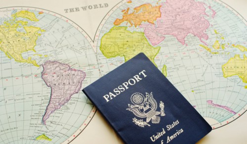 Close-up of passport lying on map.