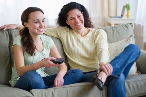 Mother talking to teenage daughter (14-15).
