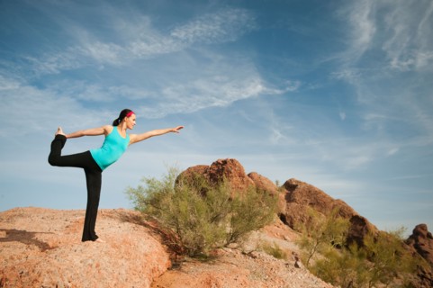 USA, Arizona, Phoenix, Young woman exercising on desert.