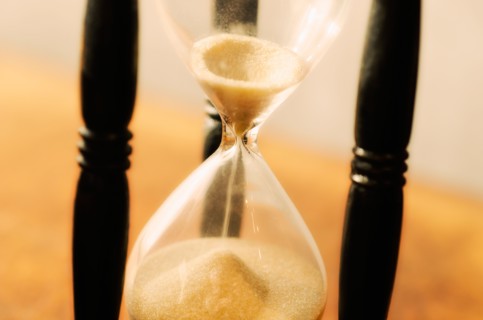 Hourglass with pouring sand.