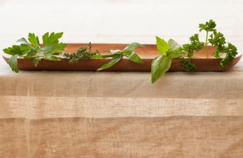 Fresh herbs on plate.