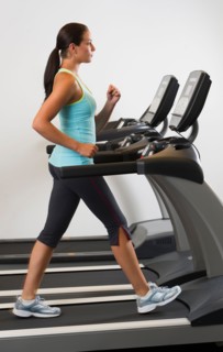 Woman walking on treadmill.