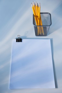 Paper and pencils in cup, studio shot. Photo : Daniel Grill