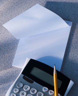 Calculator and blank paper. Photo : Daniel Grill