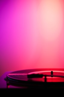Close up of turntable on pink background. Photo : Daniel Grill