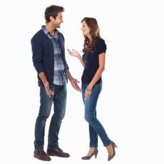 Studio shot of young couple smiling and talking. Photo: momentimages